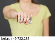 woman crushing packet of cigarettes. Стоковое фото, агентство Ingram Publishing / Фотобанк Лори