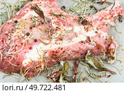 Raw pork chop steak Tomahawk marinated in spicy herbs. Raw barbecue Tomahawk steak. Стоковое фото, агентство Ingram Publishing / Фотобанк Лори