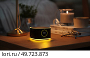 Virtual assistant represented as a glowing orb of data. dot home assistant smarthome speaker. Intelligent home assistant hub, glowing touch interface, minimal style. Стоковое AI-изображение, AI-художник ALLA YURTAYEVA / Фотобанк Лори