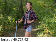 portrait of woman on nature walk holding a cane. Стоковое фото, агентство Ingram Publishing / Фотобанк Лори