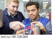 young student of mechatronics working on project. Стоковое фото, агентство Ingram Publishing / Фотобанк Лори