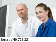 female student listening to her teacher. Стоковое фото, агентство Ingram Publishing / Фотобанк Лори