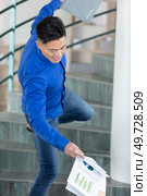 clumsy business man falling down stairs. Стоковое фото, агентство Ingram Publishing / Фотобанк Лори