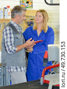 Man and lady in workshop. Стоковое фото, агентство Ingram Publishing / Фотобанк Лори