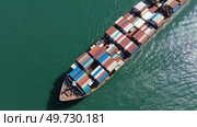 Cargo ship filled with containers in port area. Стоковое фото, фотограф Михаил Коханчиков / Фотобанк Лори