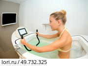 a girl is is aquacycling session. Стоковое фото, агентство Ingram Publishing / Фотобанк Лори