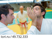 Two men in judo combat. Стоковое фото, агентство Ingram Publishing / Фотобанк Лори