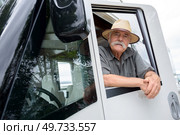 logistics man in front of a container truck. Стоковое фото, агентство Ingram Publishing / Фотобанк Лори