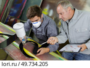 young man or worker in protective clothing with spray gun. Стоковое фото, агентство Ingram Publishing / Фотобанк Лори