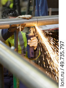constructions worker welding with sparkles. Стоковое фото, агентство Ingram Publishing / Фотобанк Лори