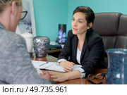 a sad woman in an office. Стоковое фото, агентство Ingram Publishing / Фотобанк Лори