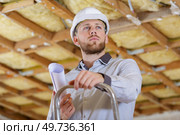 man posing near ladder repair design constructor. Стоковое фото, агентство Ingram Publishing / Фотобанк Лори