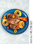 Delicious grilled meat,roasted with pineapple. Grilled steak and ananas, bbq. Top view.. Grilled meat steak with ananas. Стоковое фото, агентство Ingram Publishing / Фотобанк Лори