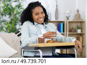 delighted crippled woman having breakfast. Стоковое фото, агентство Ingram Publishing / Фотобанк Лори