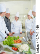 Trainees in kitchen with chef. Стоковое фото, агентство Ingram Publishing / Фотобанк Лори