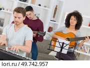 young band group rehearsing for the gig. Стоковое фото, агентство Ingram Publishing / Фотобанк Лори