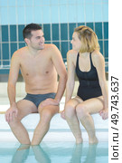 couple is having fun in swiming pool. Стоковое фото, агентство Ingram Publishing / Фотобанк Лори