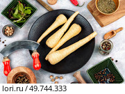 Raw and uncooked parsnips roots. Concept of healthy eating.. Raw useful parsnip roots. Стоковое фото, агентство Ingram Publishing / Фотобанк Лори