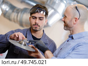 two worker in factory on the machine. Стоковое фото, агентство Ingram Publishing / Фотобанк Лори