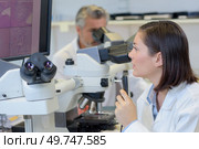 she is conducting a research. Стоковое фото, агентство Ingram Publishing / Фотобанк Лори