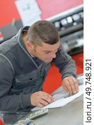 portrait of carpenter workplace check measurement. Стоковое фото, агентство Ingram Publishing / Фотобанк Лори
