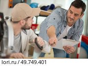 supervising teacher pointing at something. Стоковое фото, агентство Ingram Publishing / Фотобанк Лори