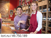 man and woman sommeliers in wine store. Стоковое фото, агентство Ingram Publishing / Фотобанк Лори