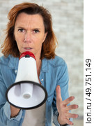 insistent older woman talking through megaphone. Стоковое фото, агентство Ingram Publishing / Фотобанк Лори