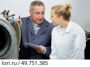 male and female engineers and technicians are repairing aircraft. Стоковое фото, агентство Ingram Publishing / Фотобанк Лори