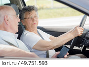 Elderly lady driving, husband talking to her. Стоковое фото, агентство Ingram Publishing / Фотобанк Лори