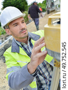 two site surveyors on a job. Стоковое фото, агентство Ingram Publishing / Фотобанк Лори