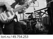 guy musician plays the drum at a concert in stage lighting. Стоковое фото, агентство Ingram Publishing / Фотобанк Лори