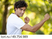 handsome man karate training in nature. Стоковое фото, агентство Ingram Publishing / Фотобанк Лори
