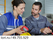 engineer checking machine in in factory. Стоковое фото, агентство Ingram Publishing / Фотобанк Лори