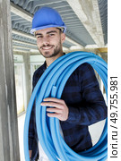 technician holding water pipes indoors. Стоковое фото, агентство Ingram Publishing / Фотобанк Лори