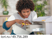 woman in rubber gloves cleaning drawer at home. Стоковое фото, агентство Ingram Publishing / Фотобанк Лори