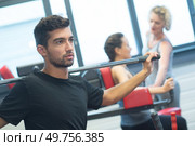athlete powerlifter exercise bench press in powerlifting competitions. Стоковое фото, агентство Ingram Publishing / Фотобанк Лори