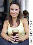 happy woman drinking cola soda oudtoors. Стоковое фото, агентство Ingram Publishing / Фотобанк Лори