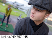 a young golfer teeing off. Стоковое фото, агентство Ingram Publishing / Фотобанк Лори