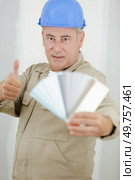 painter trying to match colours for painting job. Стоковое фото, агентство Ingram Publishing / Фотобанк Лори