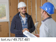 two carpenters with blueprint at workshop. Стоковое фото, агентство Ingram Publishing / Фотобанк Лори
