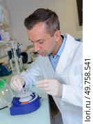 laboratory professional doing his work. Стоковое фото, агентство Ingram Publishing / Фотобанк Лори