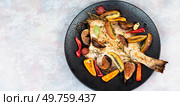 Traditional homemade braised cambala or flounder. Healthy fish dinner. Free space for your text.. Grilled fish with fruits. Стоковое фото, агентство Ingram Publishing / Фотобанк Лори