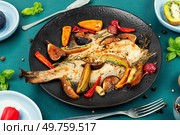 Whole flounder fish or plaice fish steamed with seasonal fruits and spices.. Whole baked flounder or flatfish. Стоковое фото, агентство Ingram Publishing / Фотобанк Лори