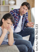 man asking for forgiveness from serious woman. Стоковое фото, агентство Ingram Publishing / Фотобанк Лори