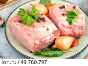 Raw pork loin chops for grill, barbecue or cooking with spices and vegetables.. Fresh pork loin. Стоковое фото, агентство Ingram Publishing / Фотобанк Лори