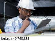 a plumber with a clipboard. Стоковое фото, агентство Ingram Publishing / Фотобанк Лори