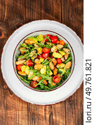 Plate showcasing mussel salad with fresh vegetables.. Tasty seafood salad. Стоковое фото, агентство Ingram Publishing / Фотобанк Лори