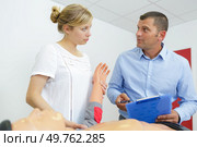 couple are training with dummy. Стоковое фото, агентство Ingram Publishing / Фотобанк Лори