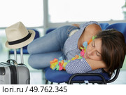 cute woman napping while waiting for flight. Стоковое фото, агентство Ingram Publishing / Фотобанк Лори